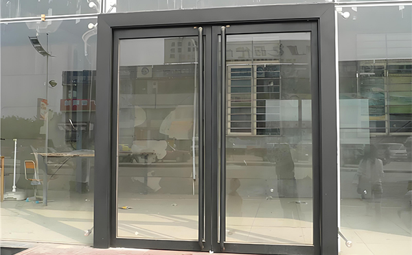 青河玻璃地弹门